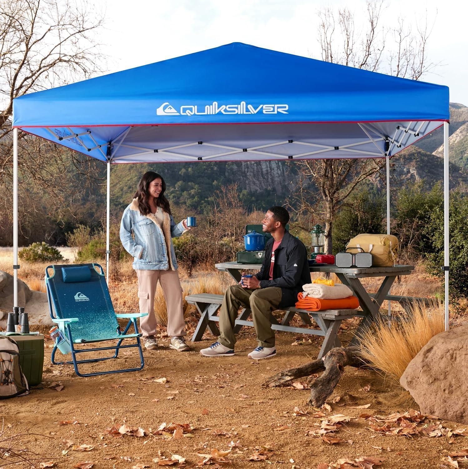 imageQuiksilver 10x10 Pop Up Canopy UPF 50 Outdoor Beach Tent with OnePush Setup Portable Shade Shelter for Beach Tailgate Festivals Camping WaterResistant Folding Gazebo with Wheeled BagSolid Blue
